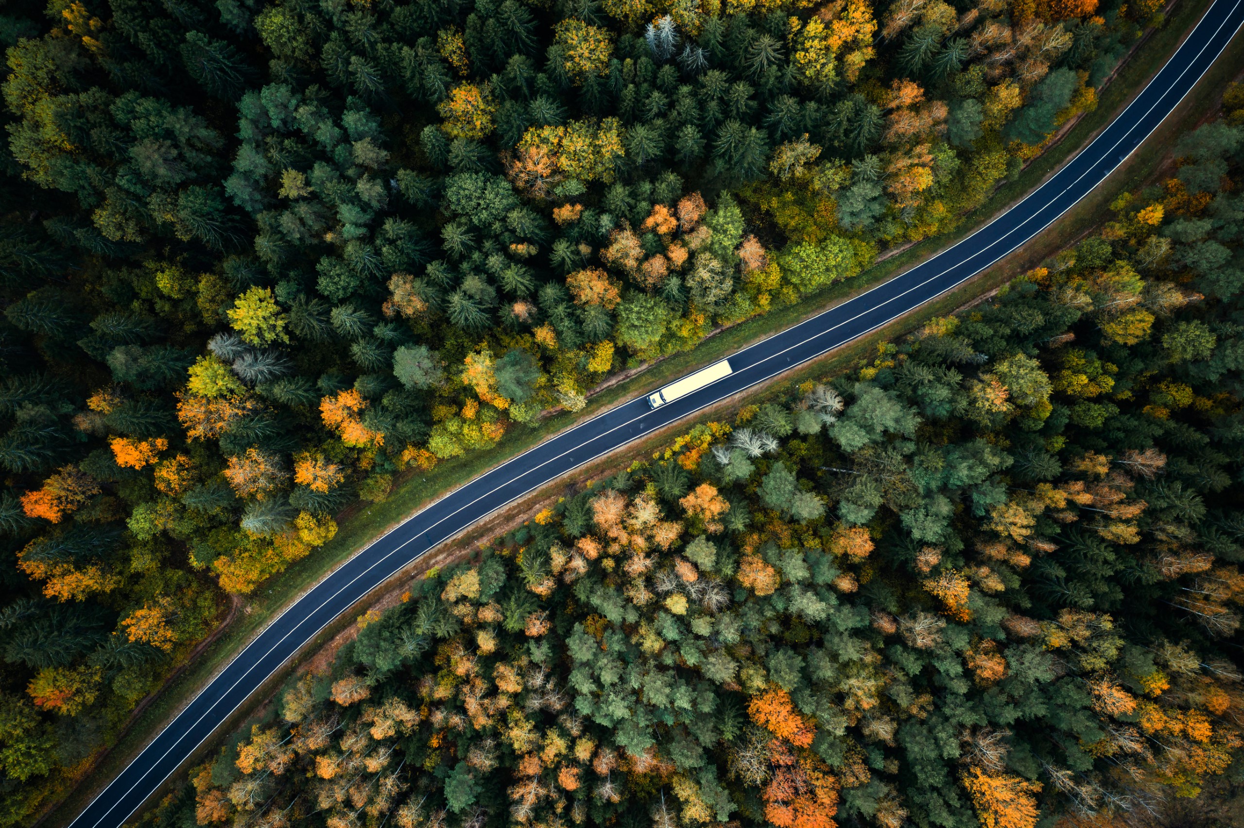 aerial_view_truck_on_winding_road