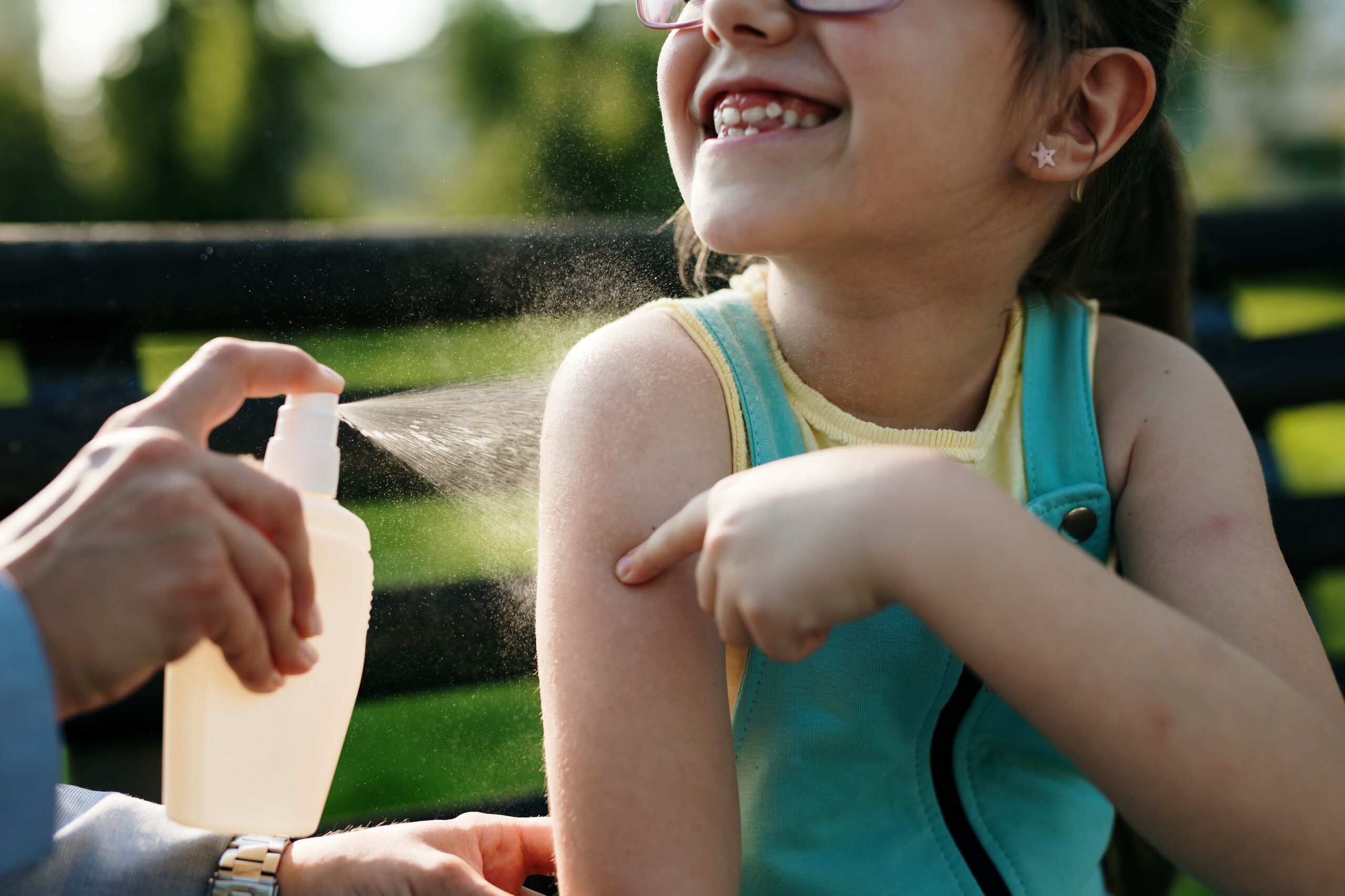 repellents_outside_mother_sprays_daughter